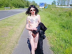 Slut Lucy Ravenblood walking nude at a public road